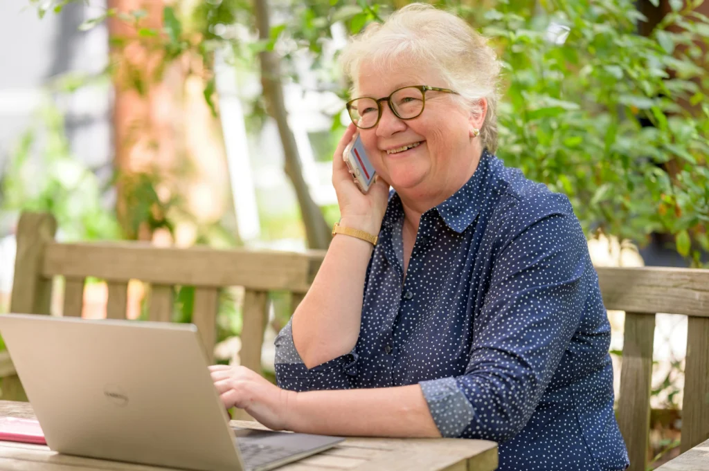 Senior using smartphone & Laptop