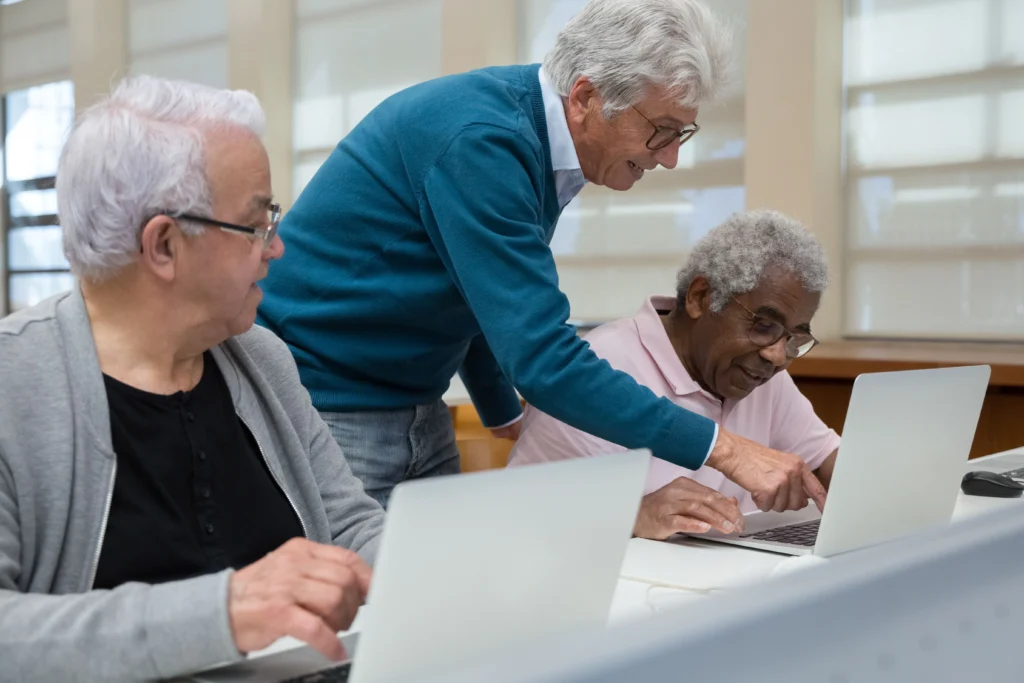 seniors behind laptop